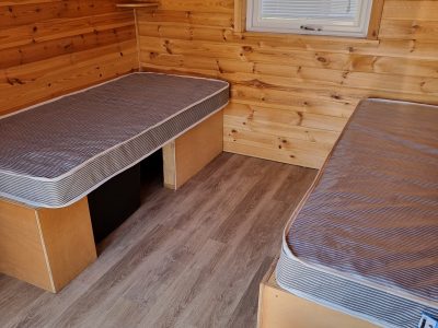 2 single beds in the camping pod